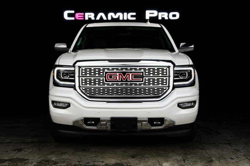 A white GMC with Kavaca paint protection film.